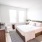 large bedroom with two windows
